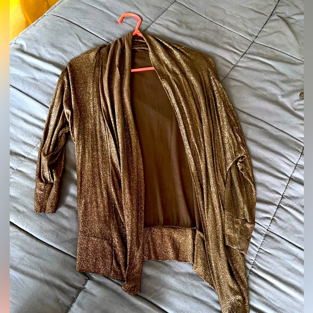 Shiny cover up, thin. Worn once